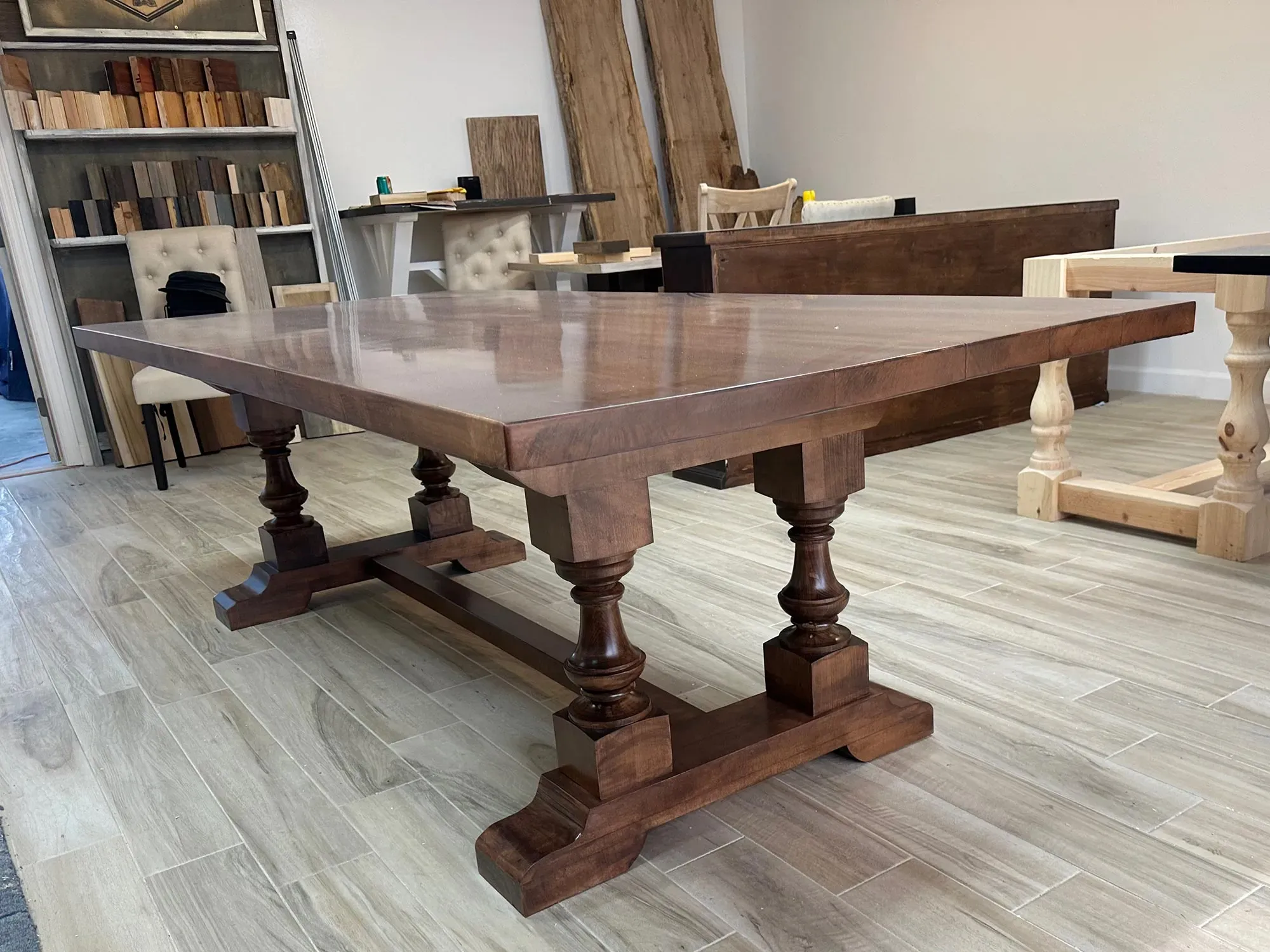 A grand statement piece with timeless elegance, The Oyster Hill Table features handcrafted pedestal legs and a rich, satin-smooth finish that anchors any dining space in classic Southern charm.
