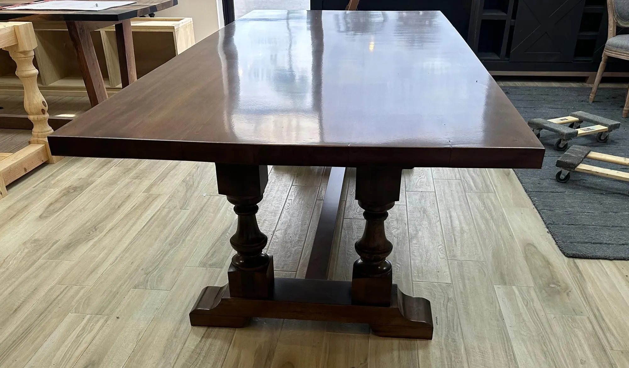 A grand statement piece with timeless elegance, The Oyster Hill Table features handcrafted pedestal legs and a rich, satin-smooth finish that anchors any dining space in classic Southern charm.